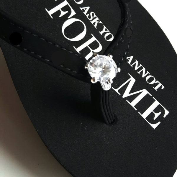 Close up of jewelry Black Designer Platform Flip Flops with Diamond Ring