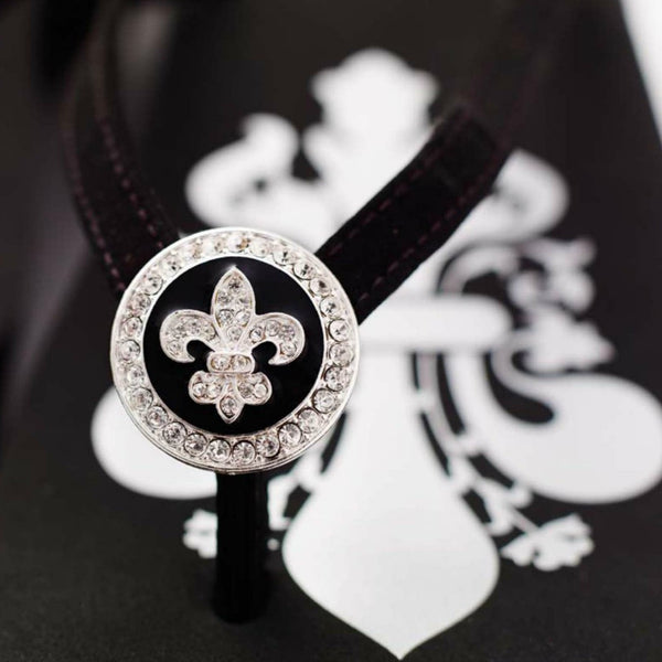 Close up of jewelry Black Designer Flip Flops Fleurs de lys