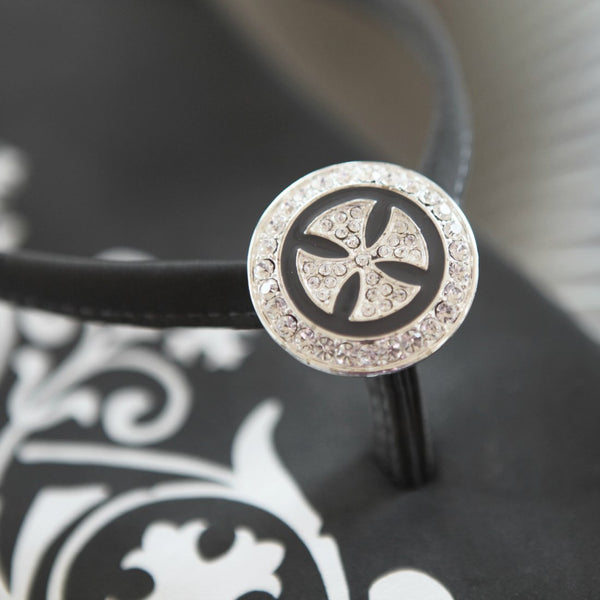 Close up of jewelry Designer Flip Flops Cross Circle Pendant