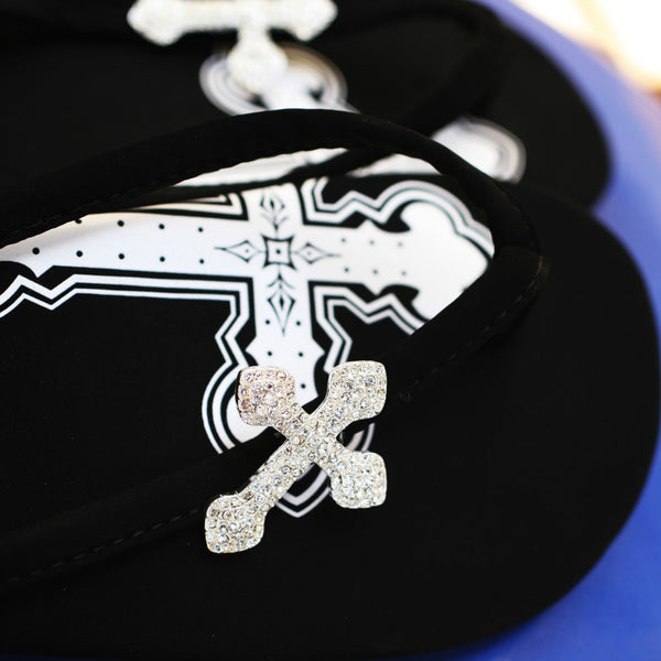 Close up of jewelry Black Designer Flip Flops Pave Cross